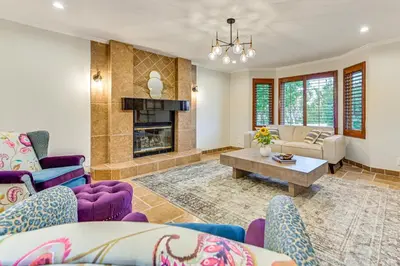 a living room with purple furniture and a fireplace at Game Room, Hot Tub and Views! Luxe Temecula Estate in Temecula