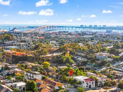 an aerial view of a city with a bridge in the background at The Treehouse by Coastline Vacation Rentals in San Diego