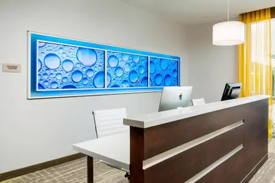 an office with a reception desk with a stained glass window at SpringHill Suites by Marriott San Diego Mission Valley in San Diego