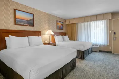 a hotel room with two beds and a window at Best Western Seven Seas in San Diego