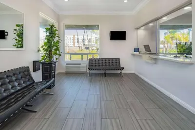 a waiting room with a bench and a window at Super 8 by Wyndham San Diego Hotel Circle in San Diego