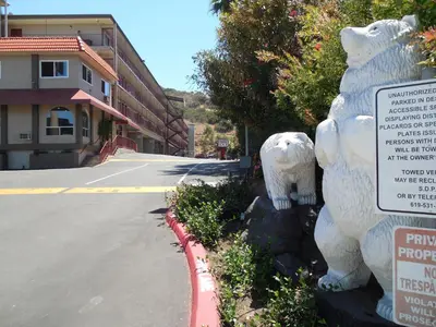 a statue of two polar bears next to a street at Super 8 by Wyndham San Diego Hotel Circle in San Diego