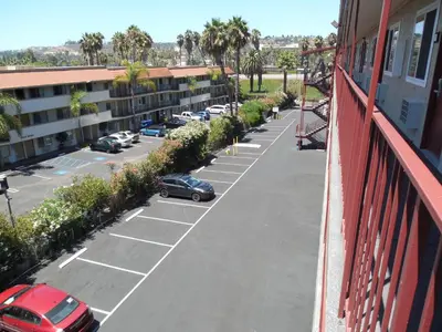 arial view of a parking lot with cars parked at Super 8 by Wyndham San Diego Hotel Circle in San Diego