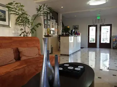 a living room with a couch and a table at El Primero Boutique Hotel in Chula Vista