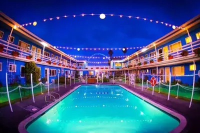 a swimming pool in the middle of a building at night at The Inn at Sunset Cliffs in San Diego