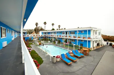 an aerial view of a hotel with a swimming pool at The Inn at Sunset Cliffs in San Diego