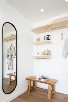 a dressing room with a mirror and a wooden table at The Pearl Hotel in San Diego