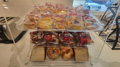 a refrigerator filled with lots of different types of pastries at SureStay Hotel by Best Western Chula Vista San Diego Bay in Chula Vista