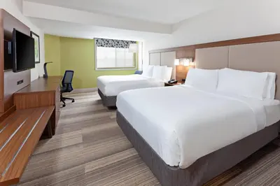 a hotel room with two beds and a flat screen tv at Holiday Inn Express Mira Mesa San Diego by IHG in Mira Mesa