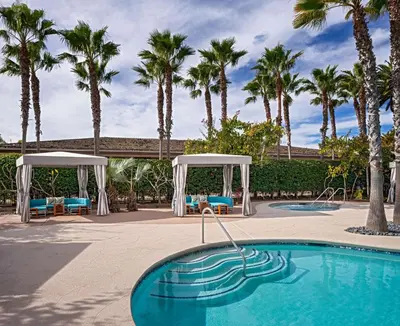 a swimming pool with palm trees in the background at Hyatt Regency Mission Bay Spa and Marina in San Diego
