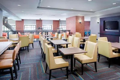 a dining room filled with tables and chairs at Residence Inn by Marriott San Diego Downtown/Gaslamp Quarter in San Diego