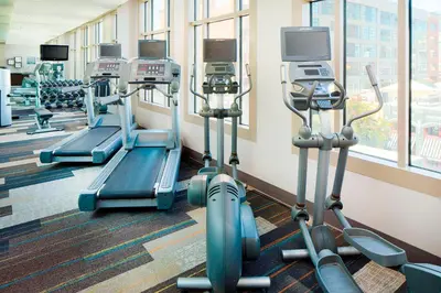 a gym with several tread machines in a room at Residence Inn by Marriott San Diego Downtown/Gaslamp Quarter in San Diego