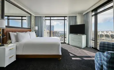 a hotel room with a bed and a television at Pendry San Diego in San Diego