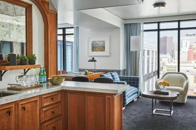 a kitchen and living room with a view of a city at Pendry San Diego in San Diego