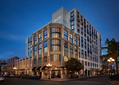 a large building on a city street at night at Pendry San Diego in San Diego