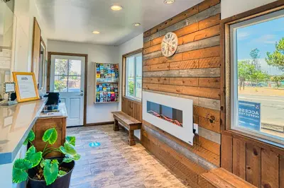a room with a wooden wall with a window at Ramona Valley Inn - Ramona in Ramona