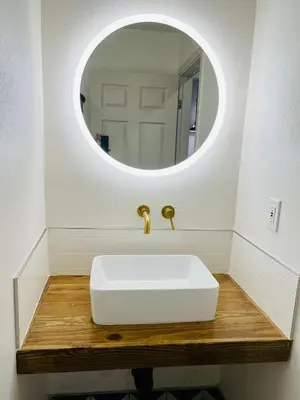 a bathroom with a white sink and a mirror at Ramona Valley Inn - Ramona in Ramona