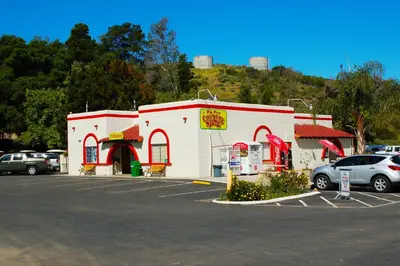a gas station with cars parked in a parking lot at Pio Pico Camping Resort Cottage 4 in Jamul