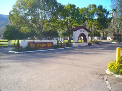 a building with a sign in the middle of a street at Pio Pico Camping Resort Studio Cabin 7 in Jamul