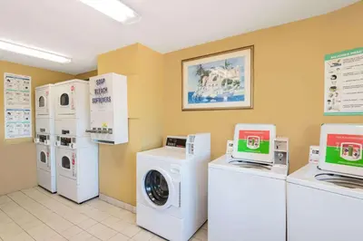 a laundry room with washers and dryers in a store at Wyndham Garden San Diego in San Diego