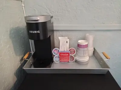 a coffee maker on a shelf in a room at Cherokee Lodge in San Diego