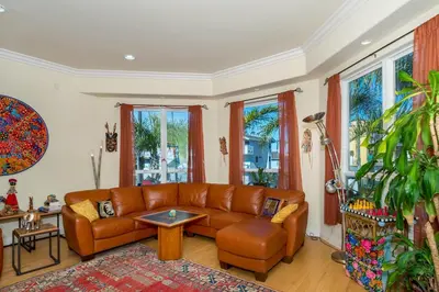 a living room with a couch and a table at Holiday Home in Oceanside
