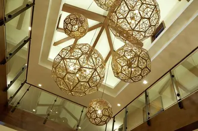 a group of lights hanging from a ceiling at Hilton Garden Inn San Diego Old Town/Sea World Area in San Diego