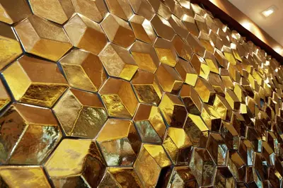 a wall covered in gold and copper tiles at Hilton Garden Inn San Diego Old Town/Sea World Area in San Diego