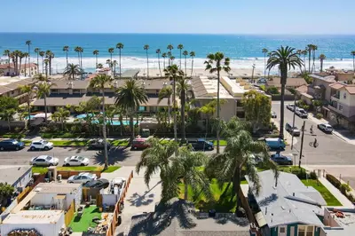 an aerial view of a parking lot and the beach at Oceanside Rocks Family Vacation Home in Oceanside