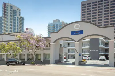a building in a city with tall buildings at Baymont by Wyndham San Diego Downtown in San Diego