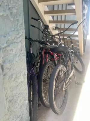 two bikes are parked next to a wall at Sweet Beach Duplex in Newport Beach