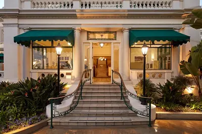 a building with a staircase leading to a door at Glorietta Bay Inn in San Diego