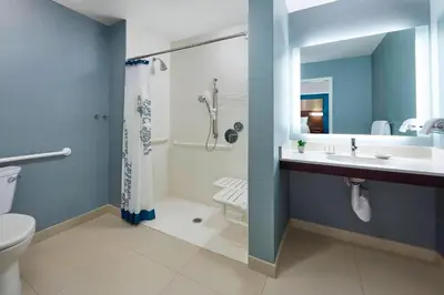 a bathroom with a toilet and a sink and a shower at Residence Inn by Marriott San Diego Chula Vista in Chula Vista