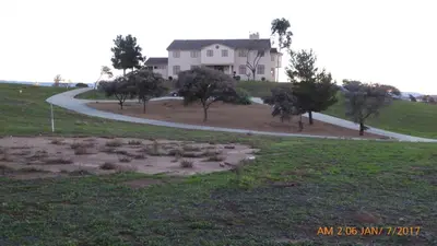 a house on top of a hill with a road at Mansion on the Hill let 4 Rooms, 5th cost extra in Sage