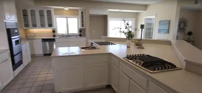 a large kitchen with white cabinets and a counter top at Mansion on the Hill let 4 Rooms, 5th cost extra in Sage