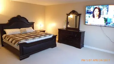 a bedroom with a bed and a flat screen tv at Mansion on the Hill let 4 Rooms, 5th cost extra in Sage