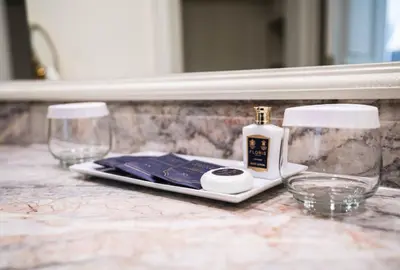 a counter with two wine glasses and a bottle on it at The Westgate Hotel in San Diego