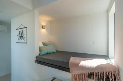 a small bedroom with a bed in a room at Modern Beach Home Steps To The Sand in San Diego