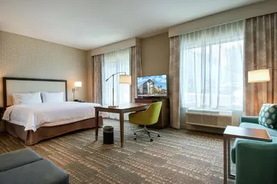 a hotel room with a bed and a desk at Hampton Inn & Suites by Hilton Mission Viejo Laguna San Juan Capistrano in Mission Viejo