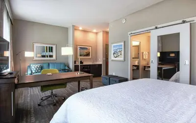 a hotel room with a bed and a desk at Hampton Inn & Suites by Hilton Mission Viejo Laguna San Juan Capistrano in Mission Viejo
