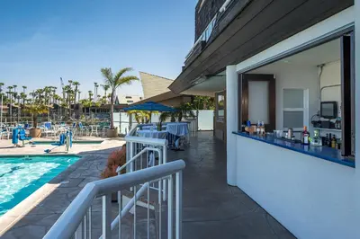 a resort with a swimming pool and a patio at Bay Club Hotel and Marina in San Diego