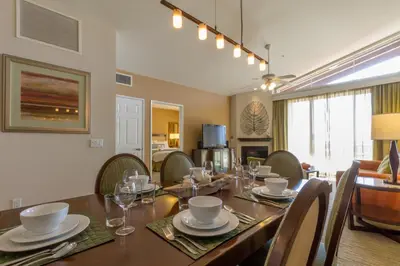 a dining room with a long table and chairs at Grand Pacific Palisades Resort in Carlsbad