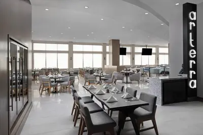 a dining room with tables and chairs in a restaurant at San Diego Marriott Del Mar in San Diego
