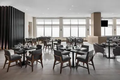 a dining room with tables and chairs in a restaurant at San Diego Marriott Del Mar in San Diego