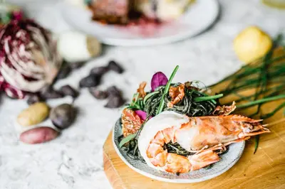 a plate of food with shrimp on a table at San Diego Marriott Del Mar in San Diego