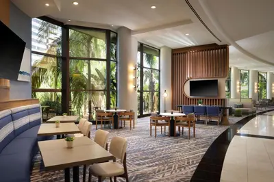 a restaurant with tables and chairs and a tv at Marriott Marquis San Diego Marina in San Diego