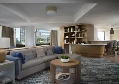 a living room with a couch and a bar at Marriott Marquis San Diego Marina in San Diego