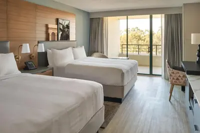 a hotel room with two beds and a balcony at San Diego Marriott Mission Valley in San Diego