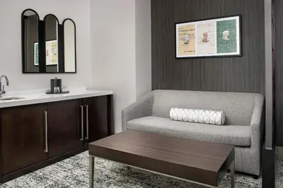 a living room with a chair and a sink at Courtyard by Marriott San Diego Downtown in San Diego