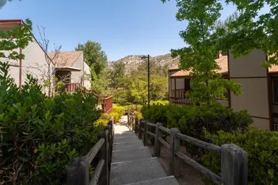 a stairway leading up to a building with a mountain at San Diego Country Estates in Ramona